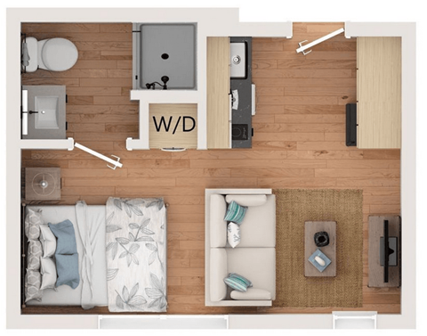 A top down view of a living room with a couch, a coffee table, and a rug.